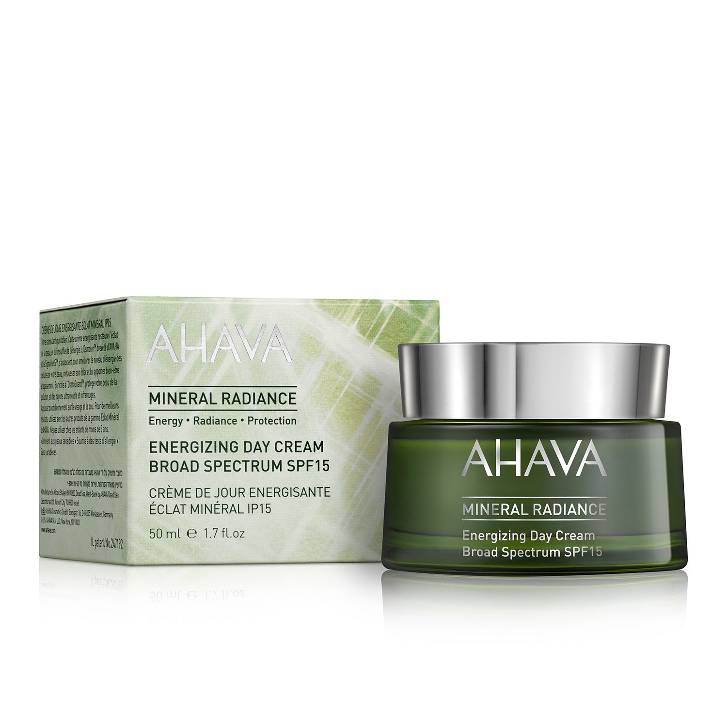 AHAVA Mineral Radiance Energizing Day Cream SPF15, 50 ml, in grünem Tiegel neben der Verpackung.